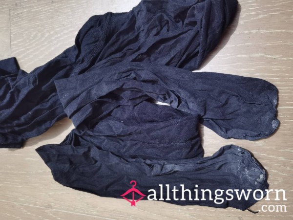 Thin Black Pantyhose Filled With Foot Residue.