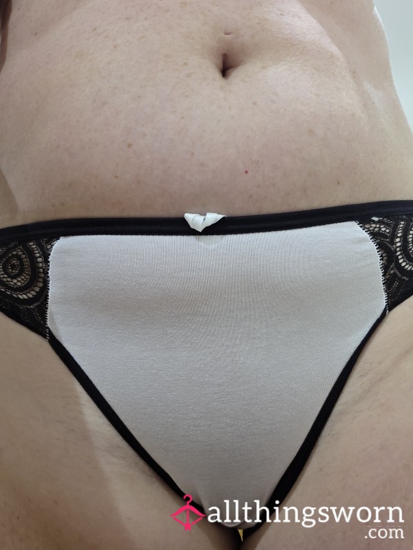 Tight Fitting White Bikini Style Panties Black Trim