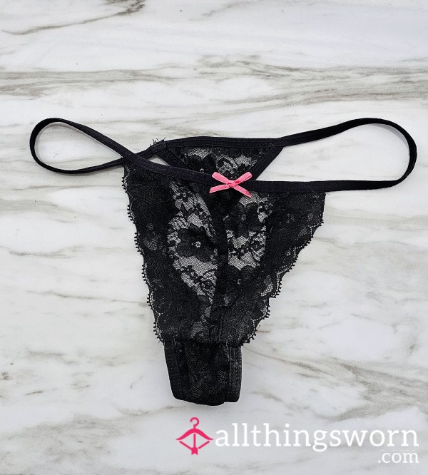 Tiny Black Thongs With Pink Ribbon.