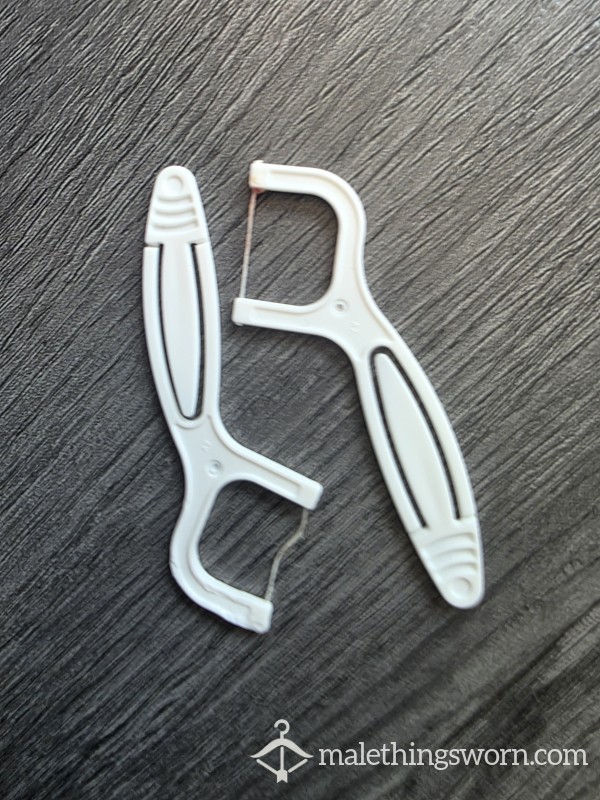 Two Used Flossers / Tooth Picks