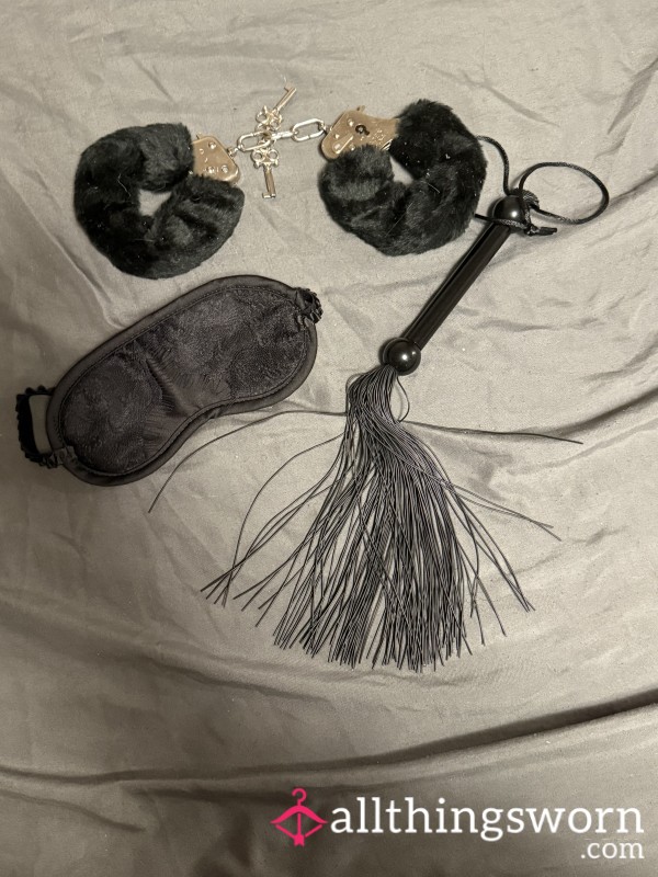 Used Cuffs, Whip, And Blind Fold