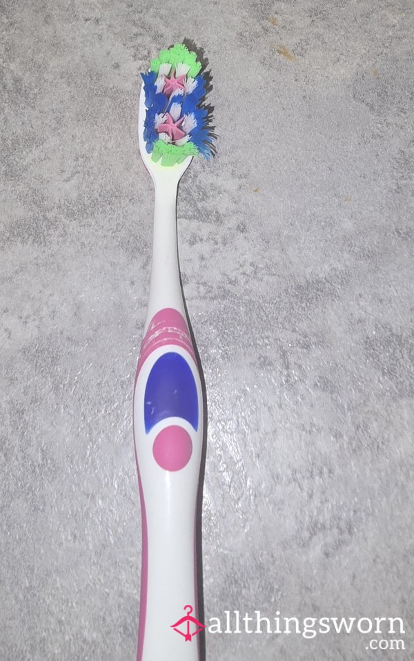 Used Pink And White Toothbrush