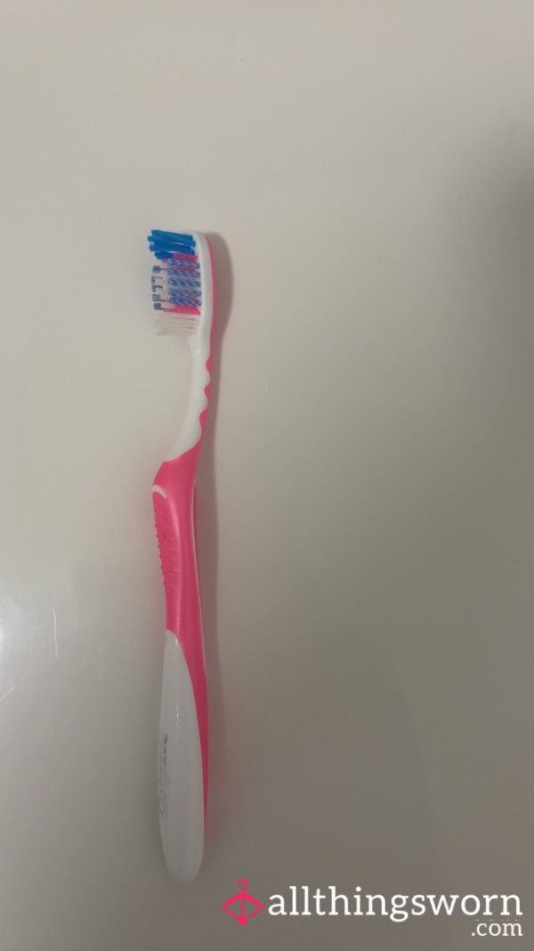 Used Pink Toothbrush