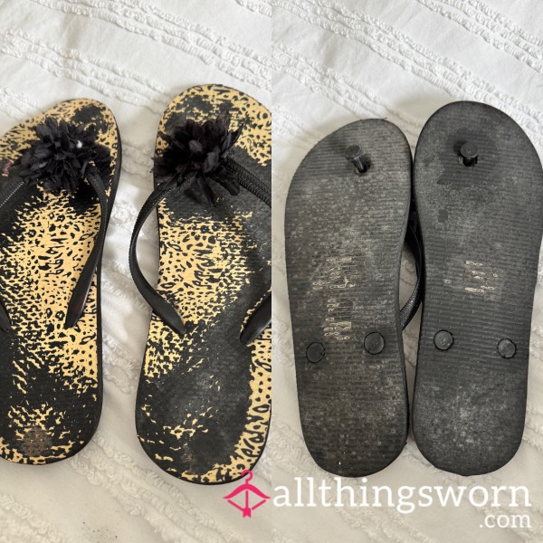 Very Worn Black Flip Flops