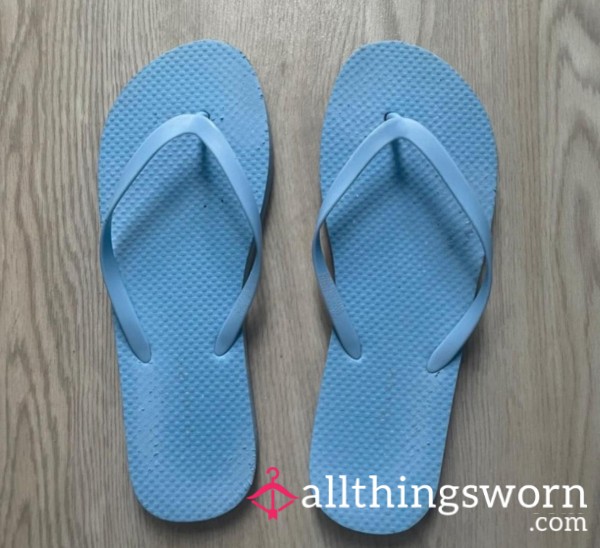 Very Worn Blue Flip Flops
