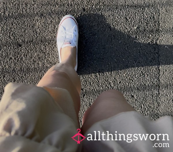 Walking Down The Road In The Sun In White Converse