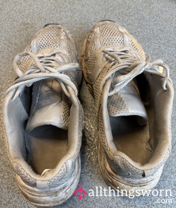 Walking In Worn Out  Trainers