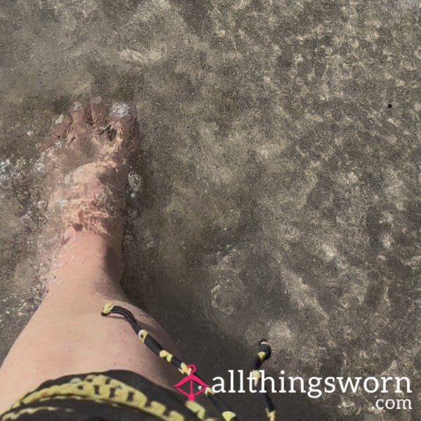 Walking Through The Sand And Sea