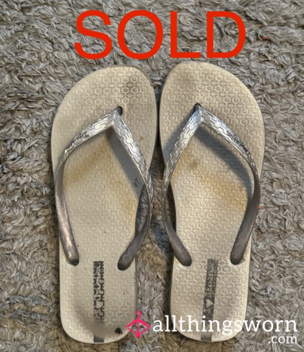 Well-loved Dirty Silver Flip-Flops