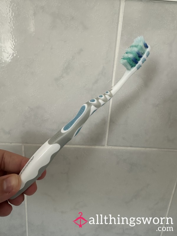 Well-used Toothbrush (Not Rinsed) And Vial Of Used Toothbrush