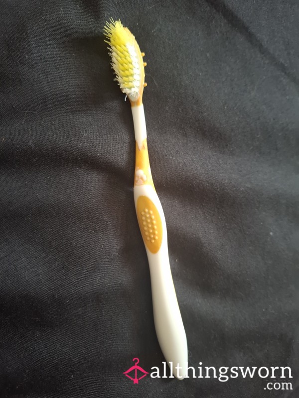 Well Used Toothbrush With Lipstick Stain