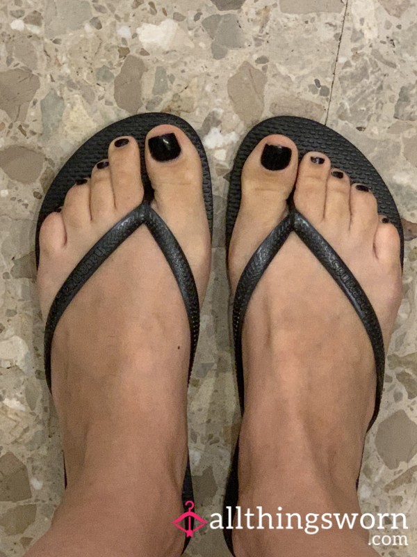 Well Worn Black Flip Flops