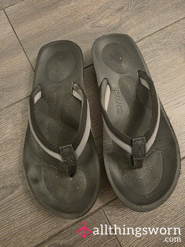 Well Worn Black Flip Flops