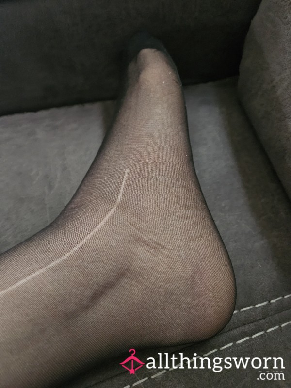 Well-worn Black Pantyhose With Runs From Use