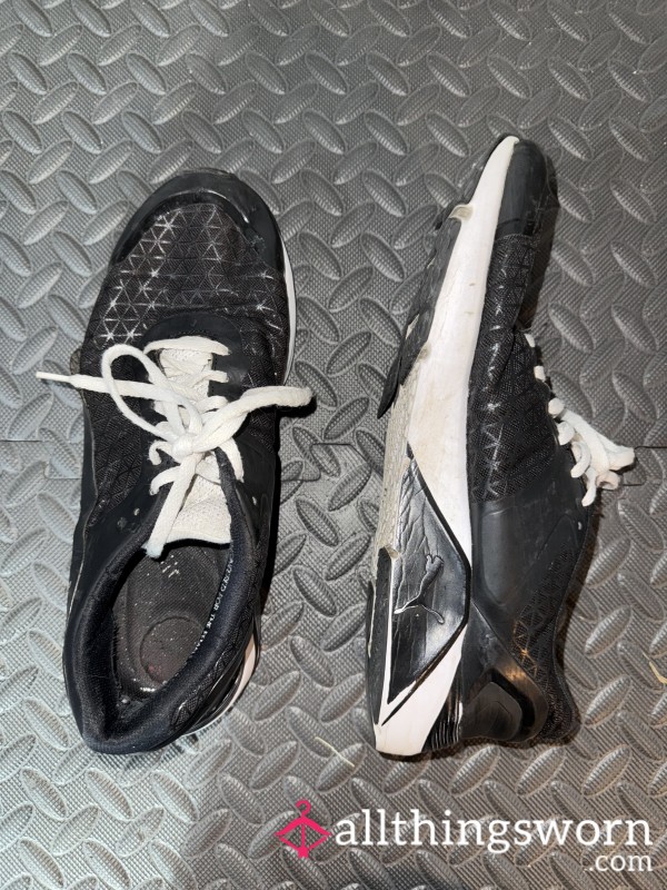 Well Worn Black Puma Sneakers