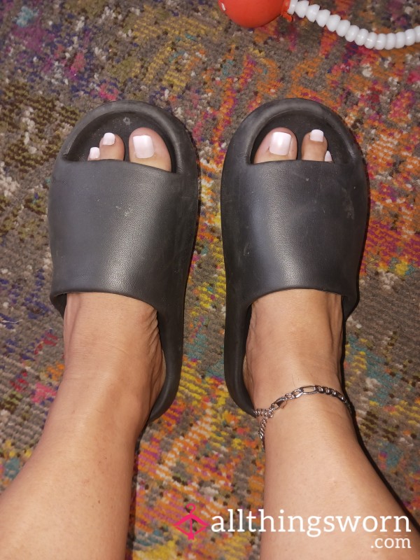 Well-worn Black Shower Slippers