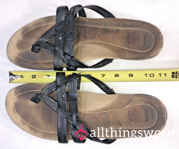 Well-Worn Earth Origins Sandals With Beautiful Foot Impressions