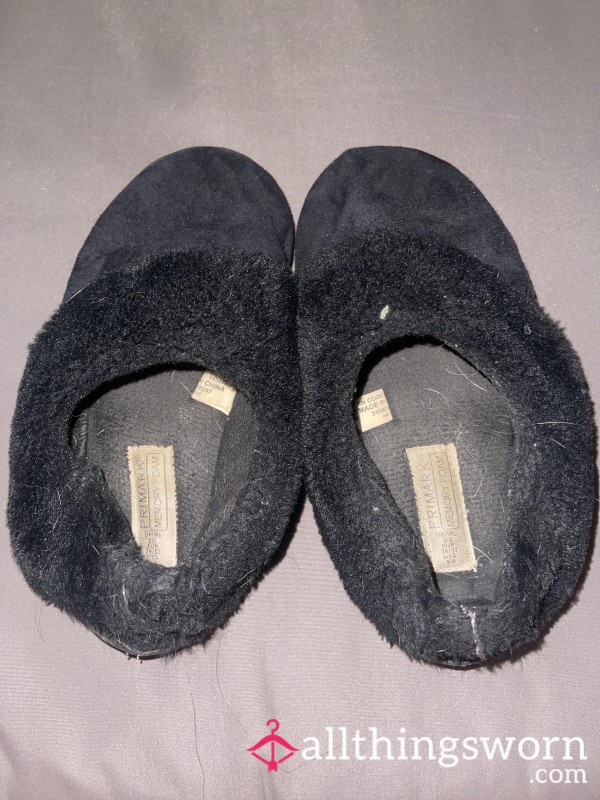 Well-worn Fluffy Black Slippers