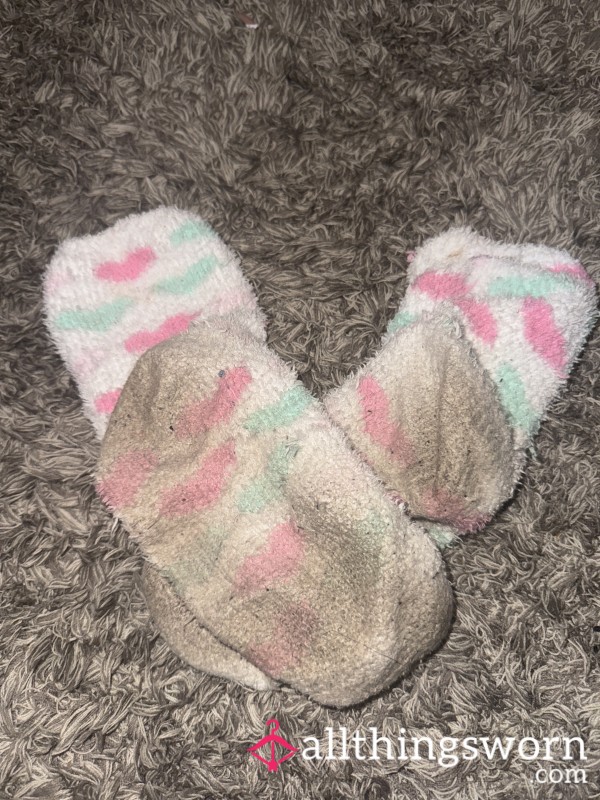 Well-Worn Fluffy White Socks – Dirty, Soft, And Full Of Character