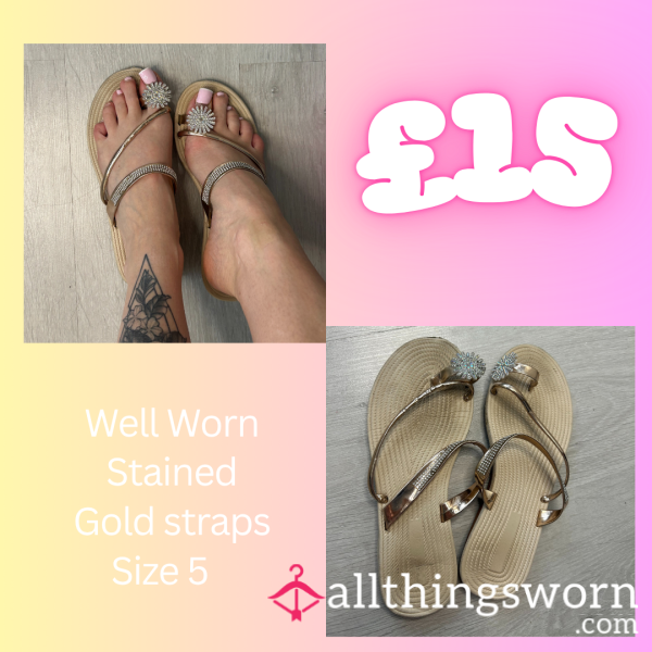 Well-worn Gold Sandals.