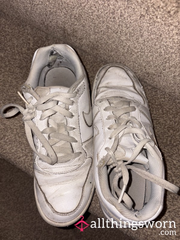 Well-worn Nike Air Force 1s White