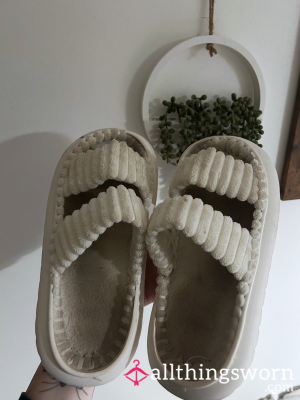 Well Worn White Slippers