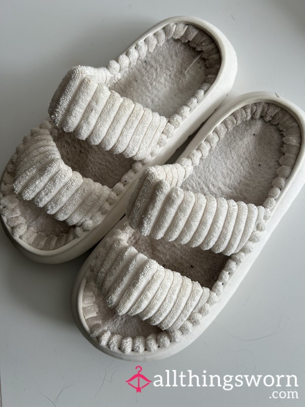 Well Worn White Slippers