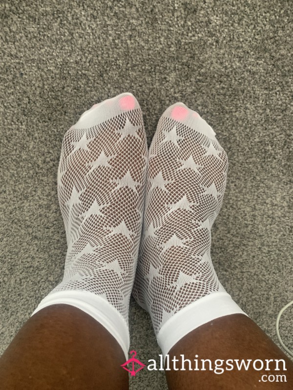 White Fishnet Socks With Stars And P**kaboo Pink Nail Polish