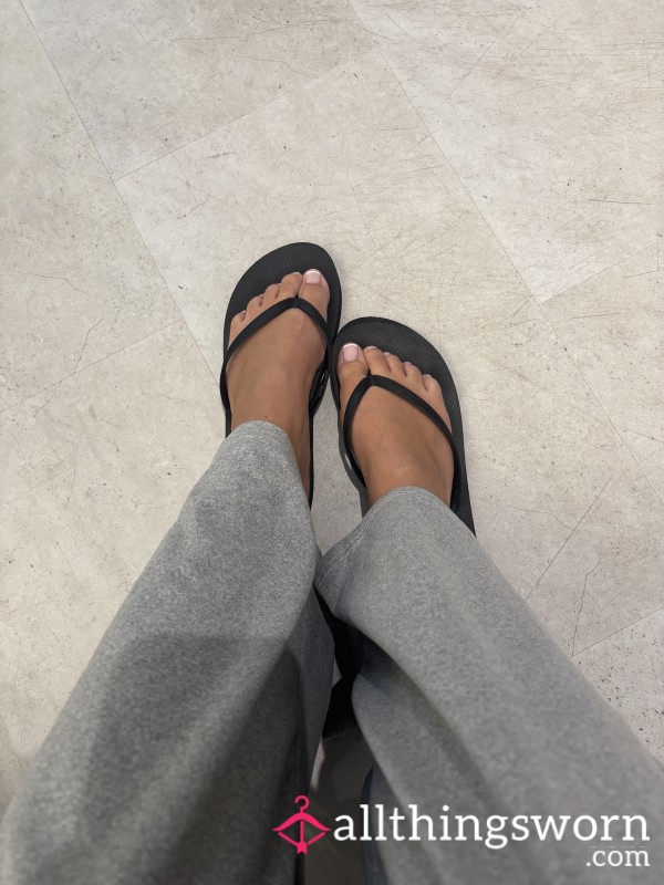 Worn Black Flip Flops