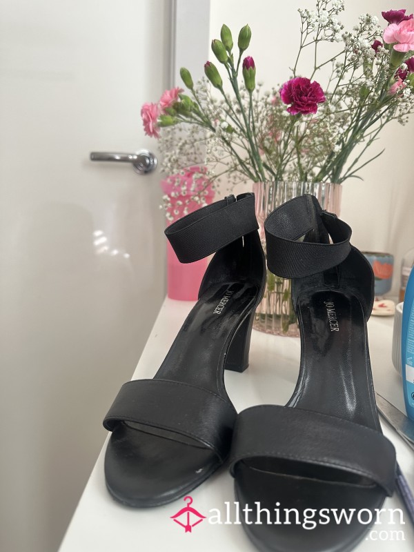 Worn Black Leather High Heels