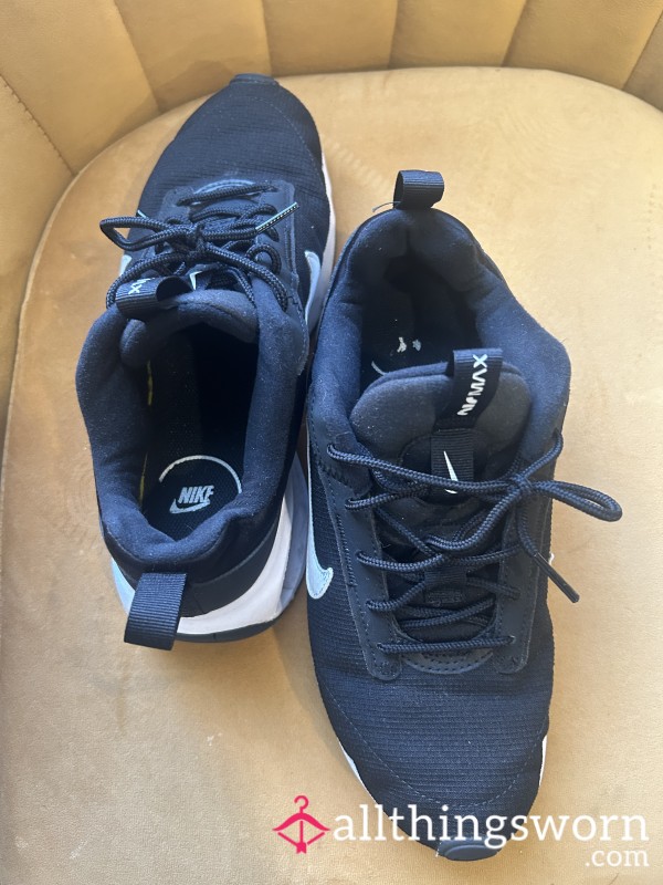 Worn Black Nike Sneakers
