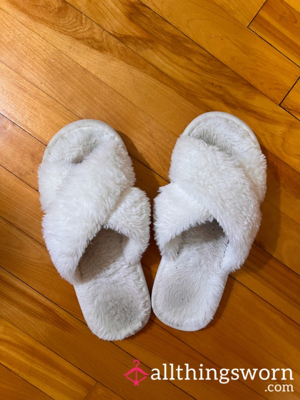 Worn Furry White Slippers With Toes Out
