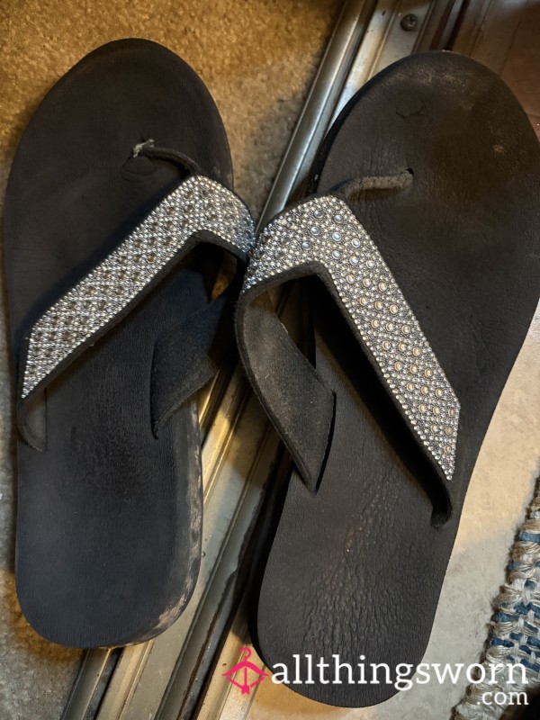 Worn In Black Flip Flops