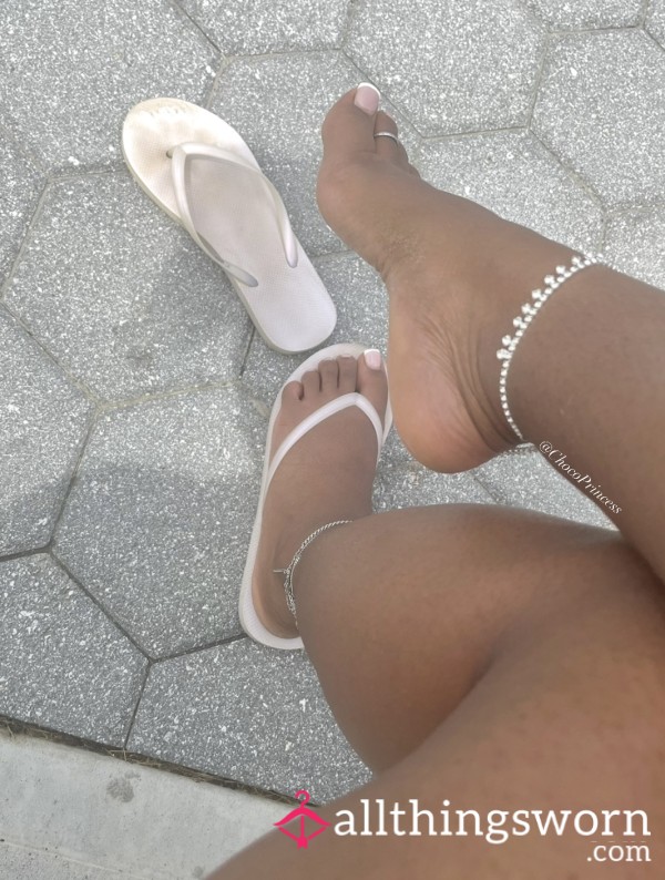 Worn White Flip Flops