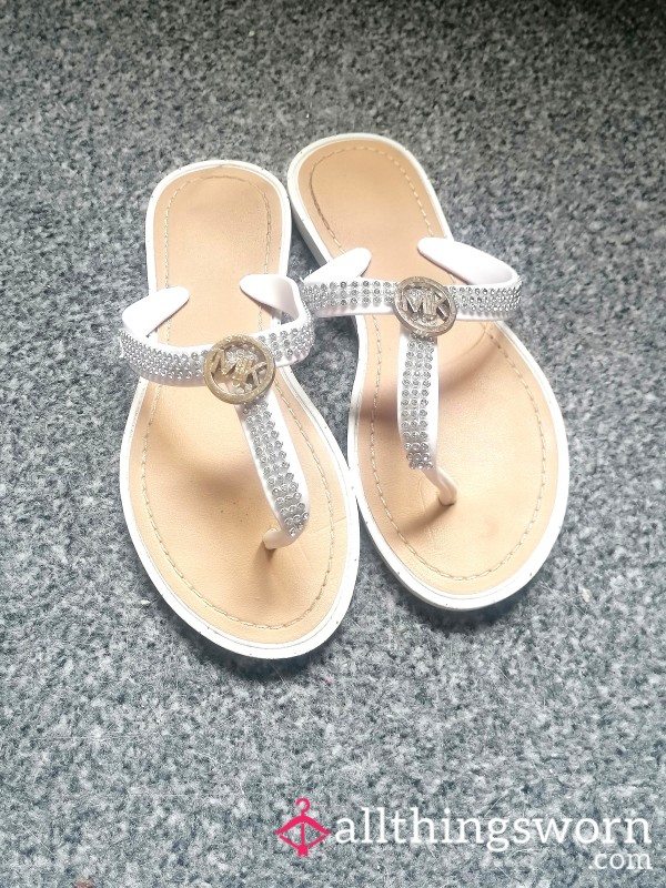 Worn White Flip Flops