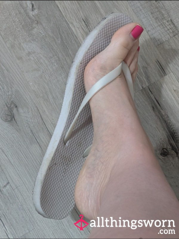 Worn White Flip Flops
