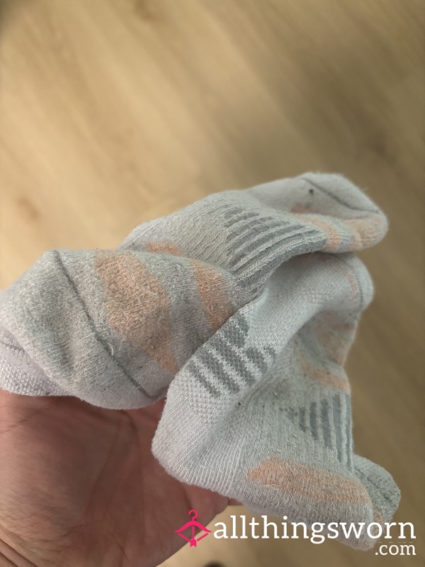 Worn White Mismatched Socks